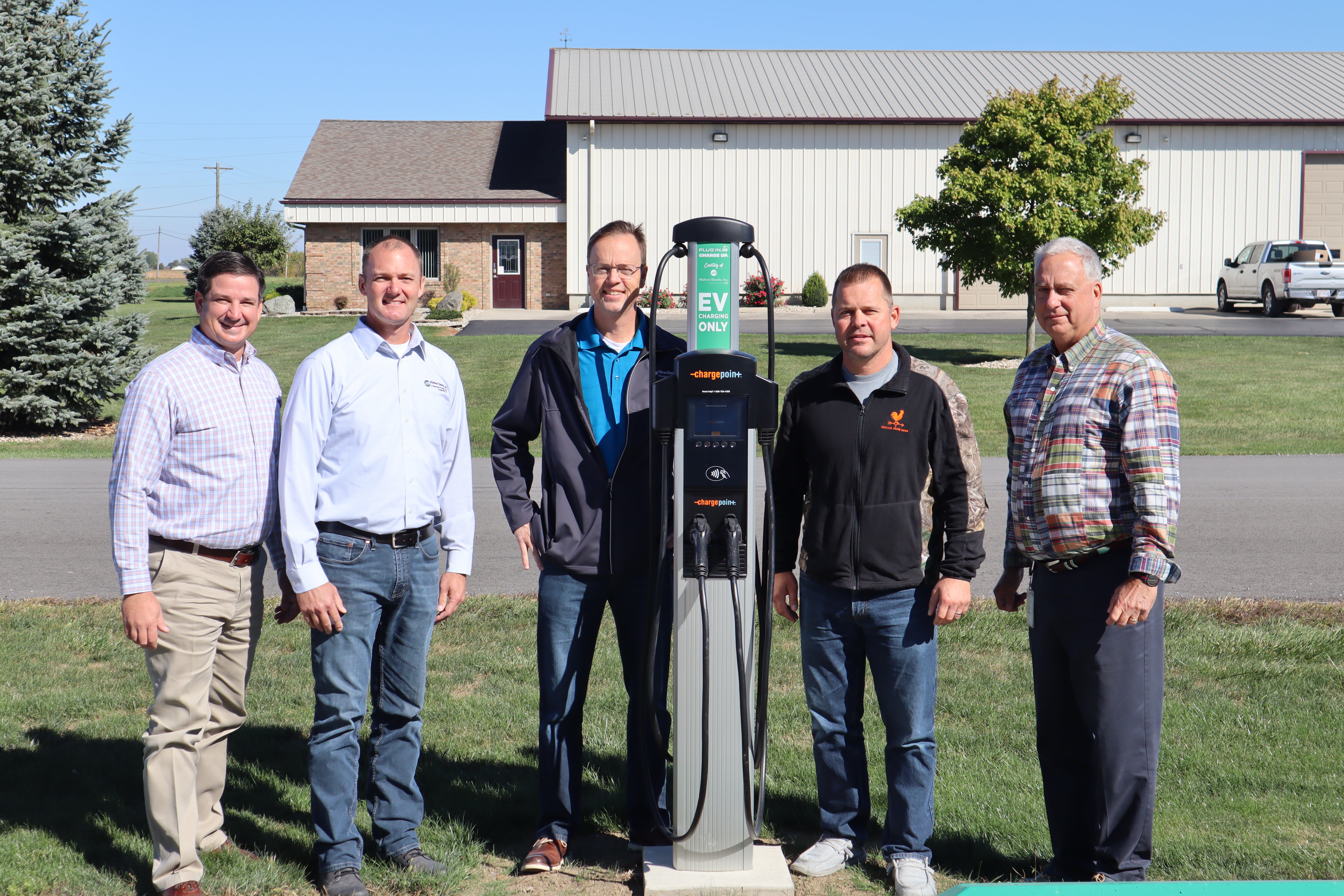 Midwest Electric staff with Nick Moeller of Moeller Brew Barn during the opening of the co-op's second electric vehicle charging station